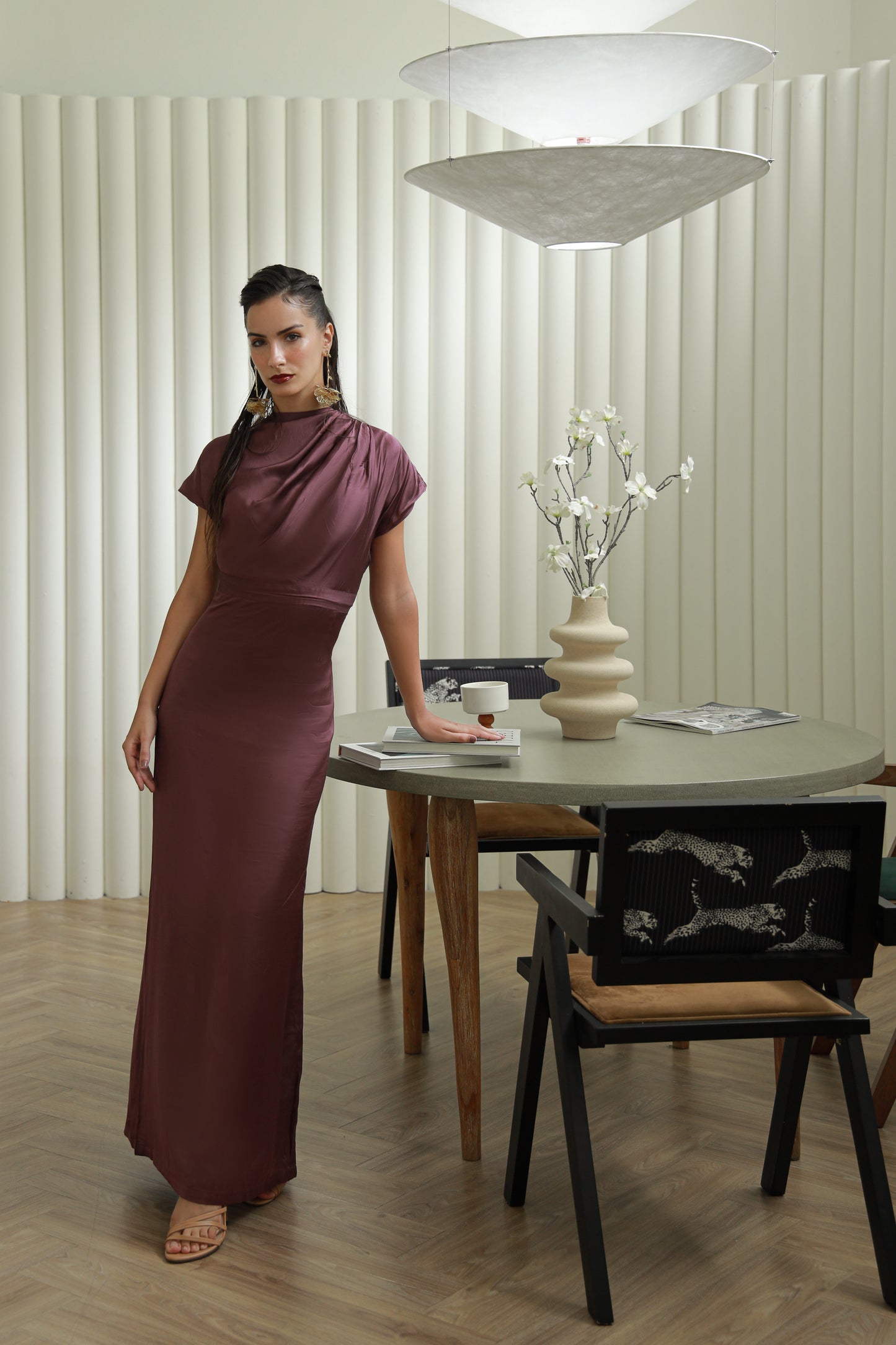 Woman in a long burgundy dress.