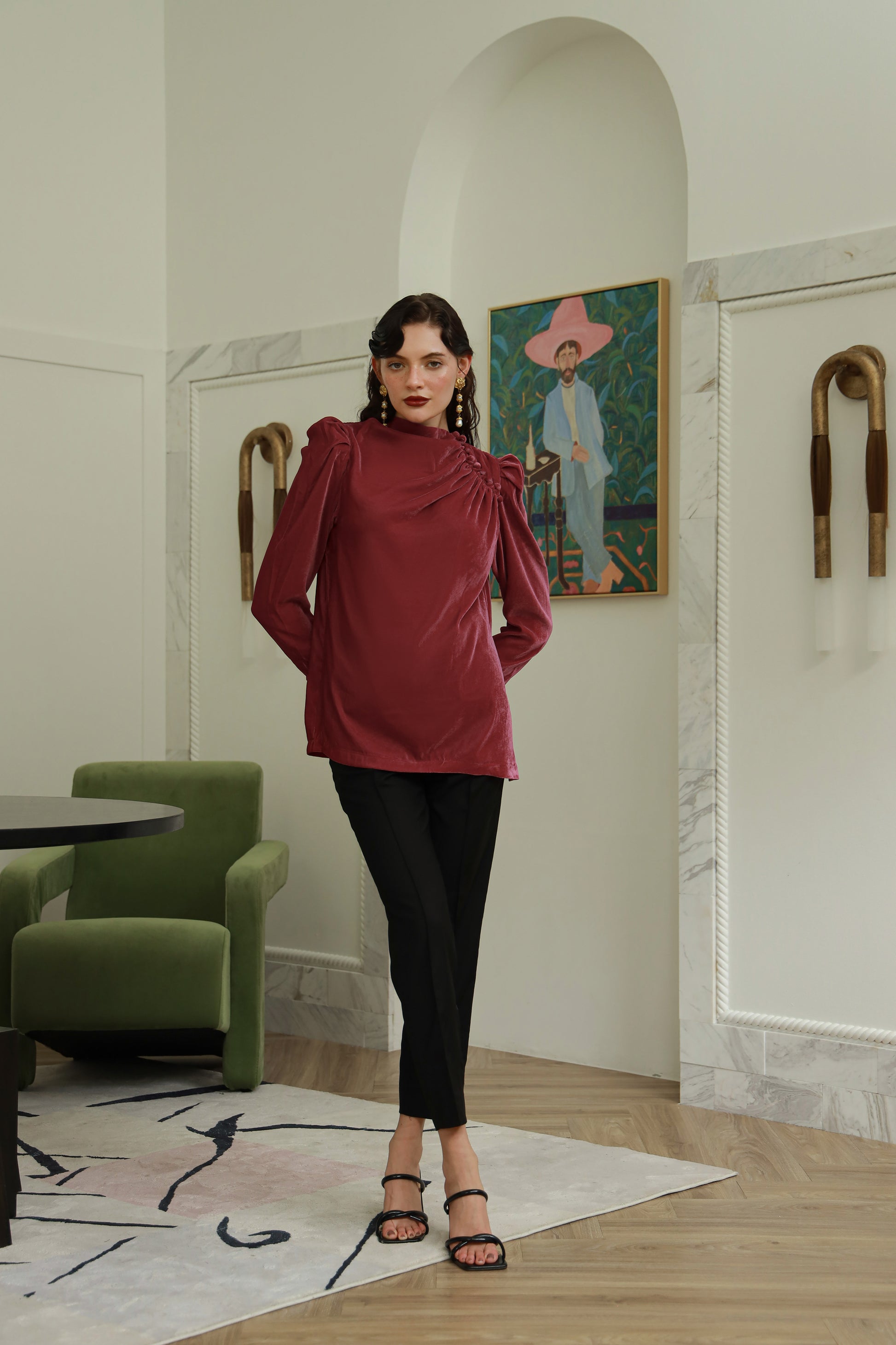 Woman in a red top and black pants